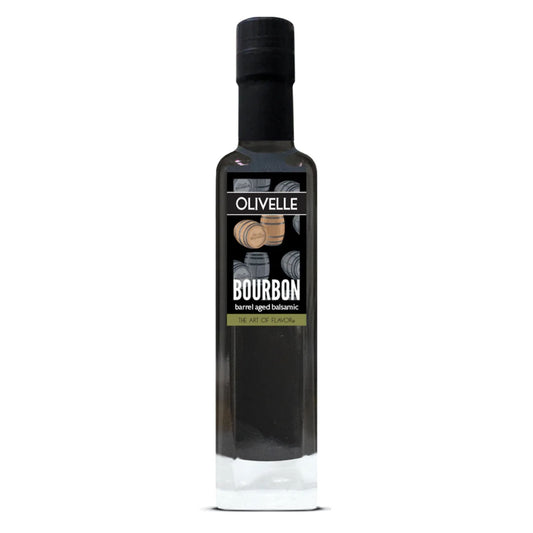 A bottle of Olivelle Bourbon mild malt vinegar, 500ml, featuring a tall black glass bottle with a black cap and a black label with white text and wood barrel graphics.