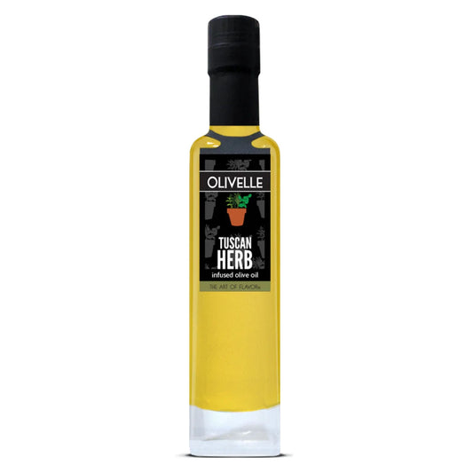 A tall, narrow glass bottle of Olivelle Tuscan Herb infused olive oil, filled with golden yellow oil and featuring a black cap and black label, set against a plain white background.